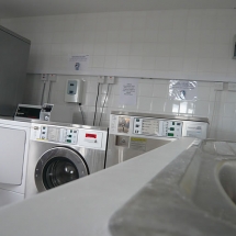 Our camping site has a large laundry room with washing machines and dryers