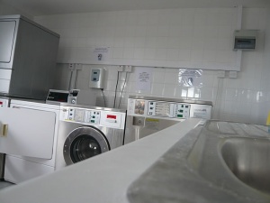 Our camping site has a large laundry room with washing machines and dryers